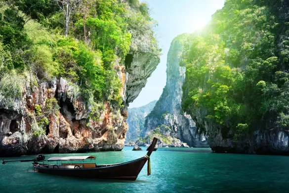Thai Long Boat And Rocks On Railay Beach In Krabi, Thailand Shutterstock 125319602