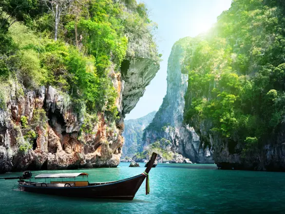 Thai Long Boat And Rocks On Railay Beach In Krabi, Thailand Shutterstock 125319602