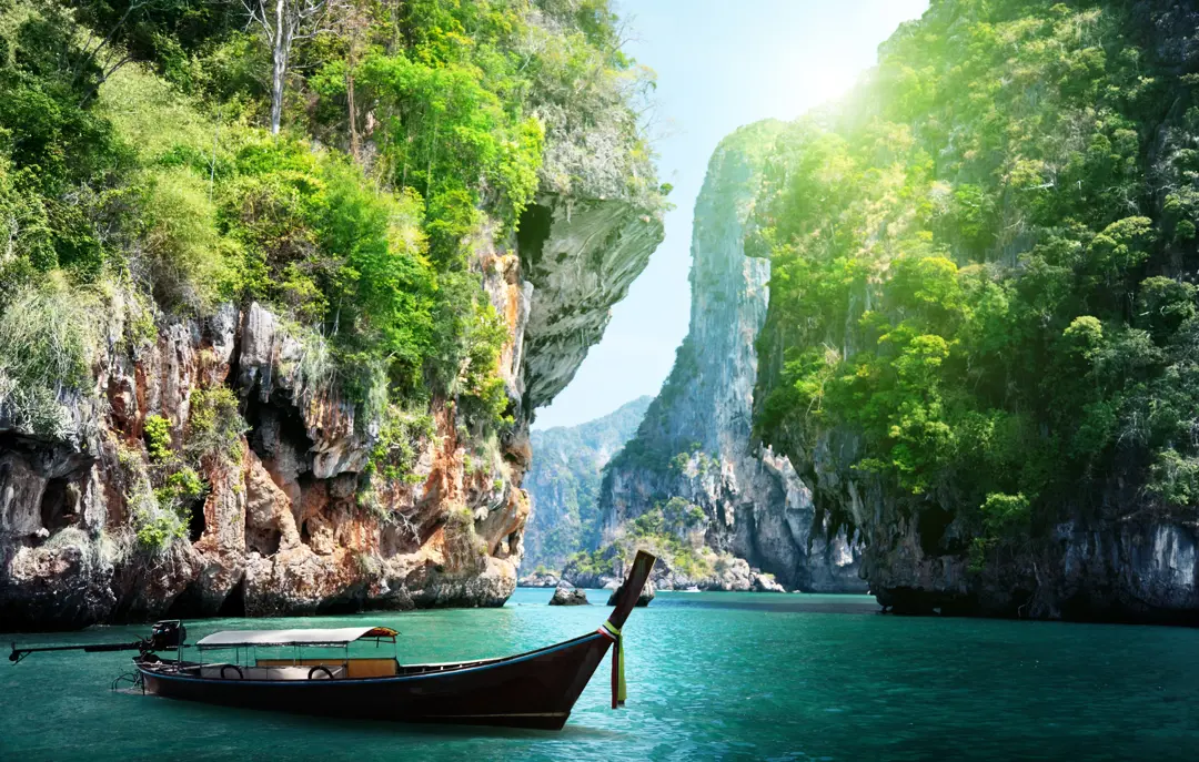 Thai Long Boat And Rocks On Railay Beach In Krabi, Thailand Shutterstock 125319602