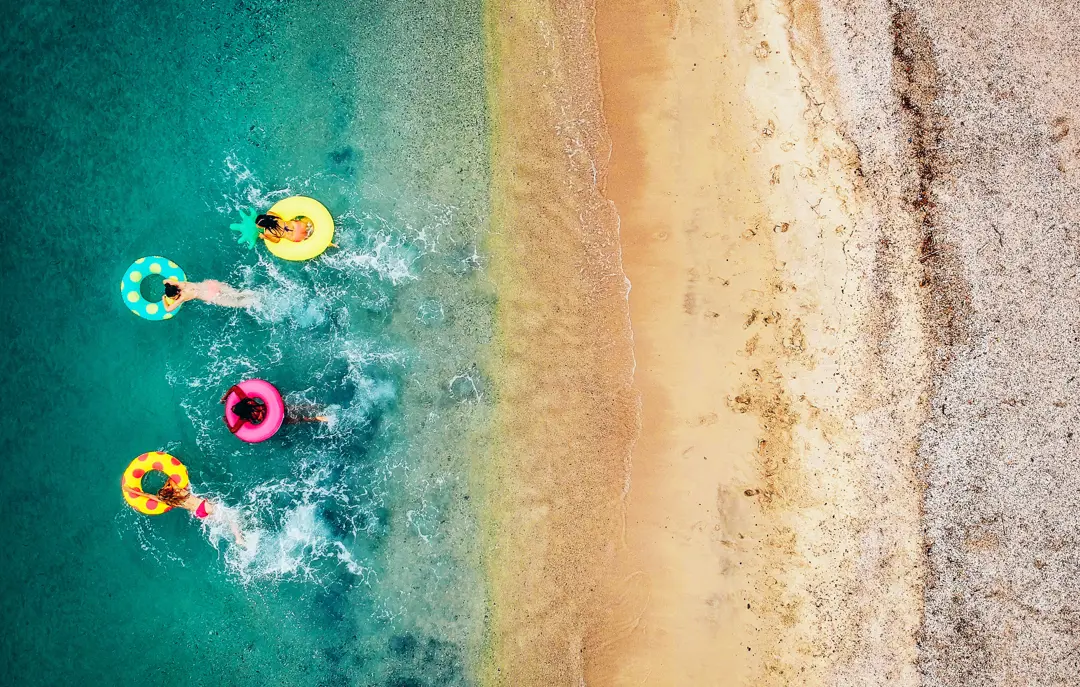 Beach With Swimming Donuts Gettyimages 993111380