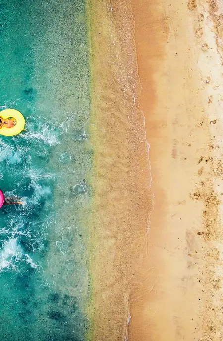 Beach With Swimming Donuts Gettyimages 993111380
