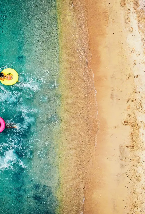 Beach With Swimming Donuts Gettyimages 993111380