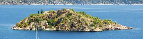 Tolo-View of the sea on Tolo with a small island and a catamaran 1.jpg